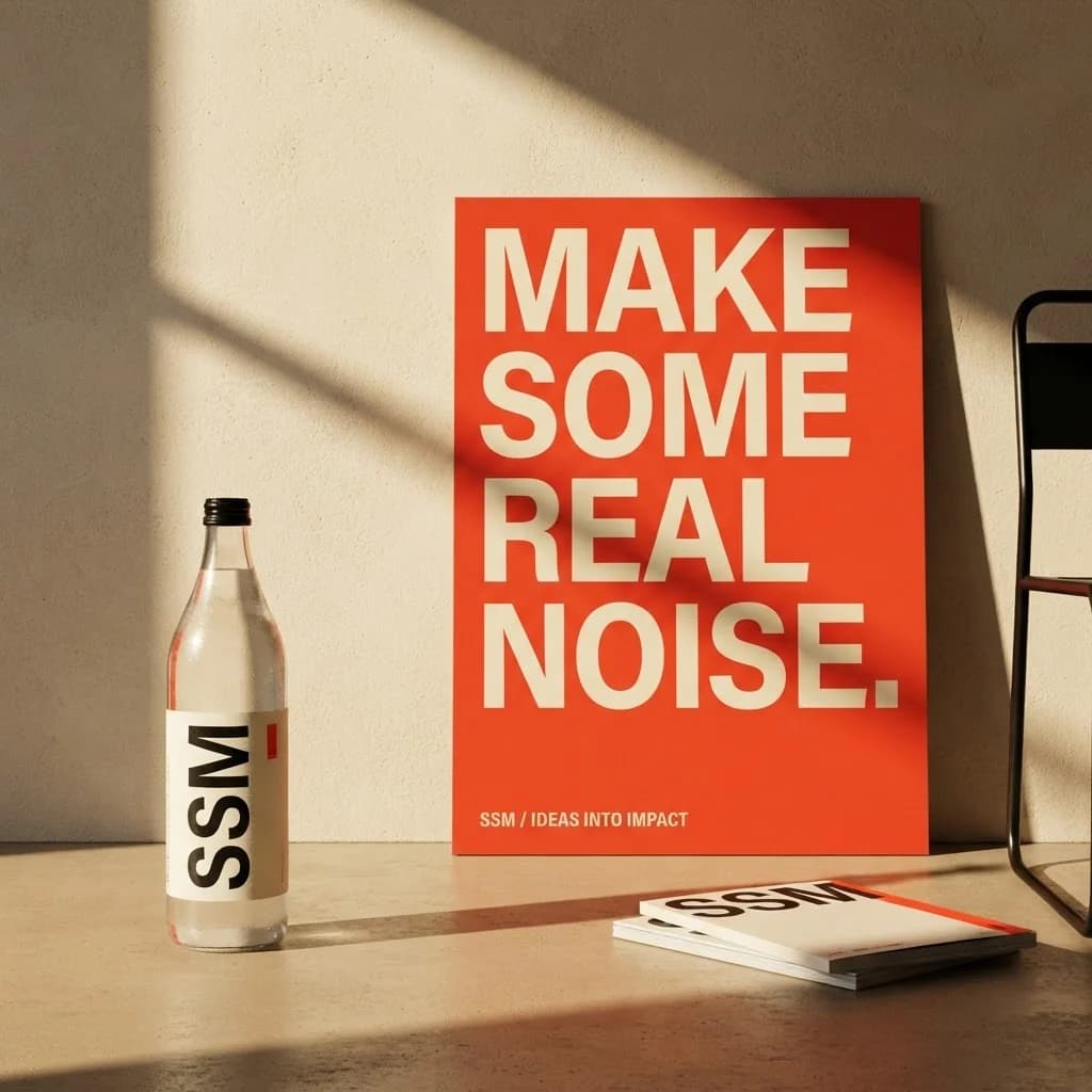 SSM brand concept: a vermilion Make Some Real Noise poster, branded bottle and printed campaign materials in a sunlit studio